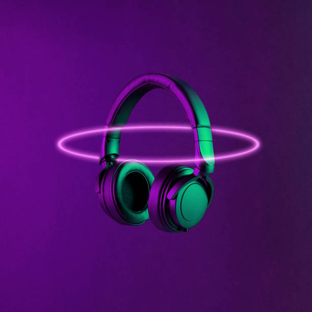 dj headphones lit with neon colorful light - brightly lit audio imagens e fotografias de stock