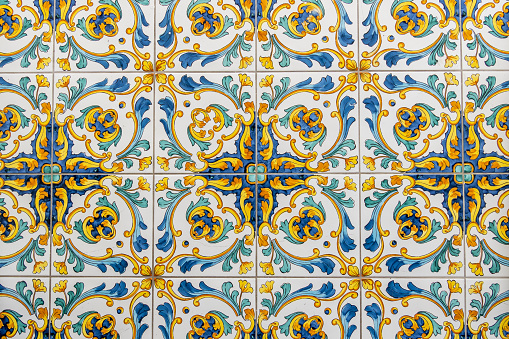 Santa Fe Style: Antique Mexican Talavera tiles; adobe wall, close-up.