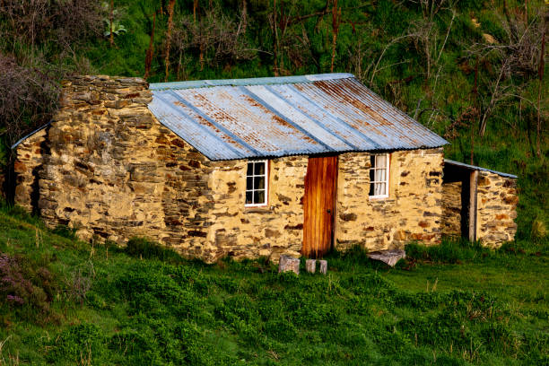 istock An Old Cabin Sits Hillside In New Zealand 1233055876