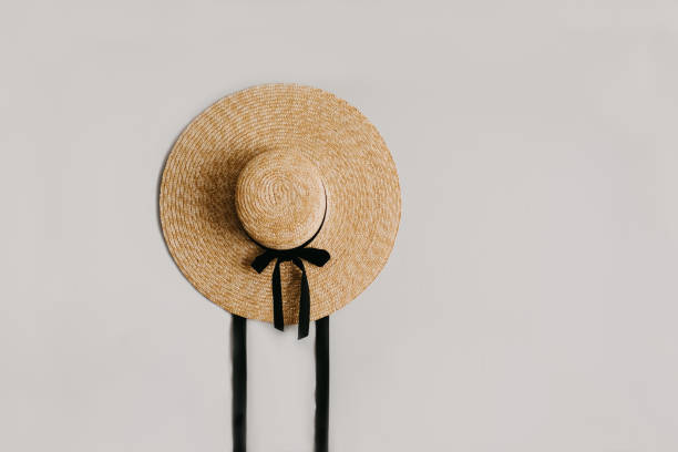 istock A straw hat with a black ribbon isolated. 1233118229