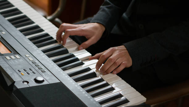 istock hands of a man playing piano 1233126891