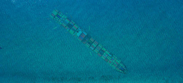 Top view of the cargo ship under sea.