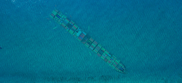 Top view of the cargo ship under sea.