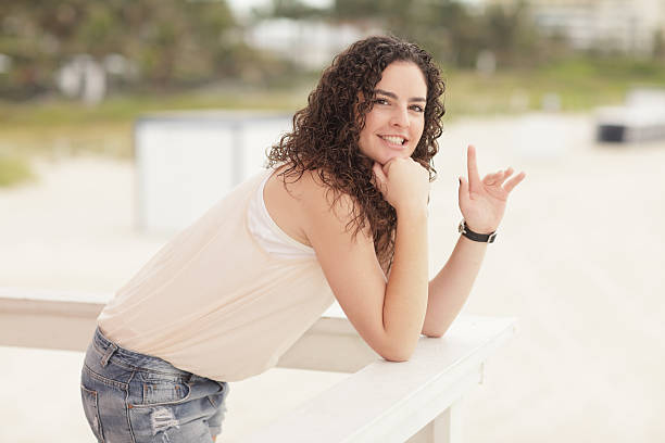 Woman waving and smiling