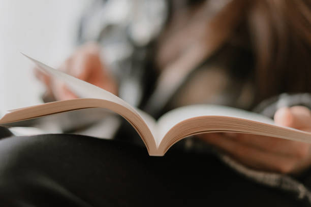 istock Analog book reading woman at home 1233308973