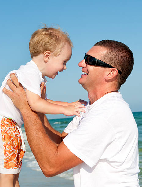 istock Father and son at the beach 123338383