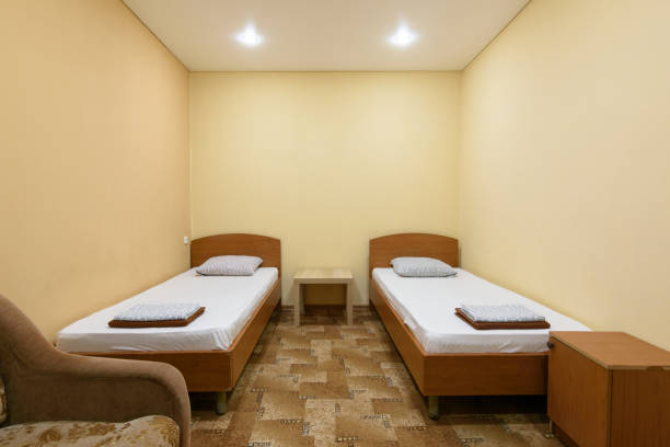 istock The interior of a budget hotel room with two beds 1233398537