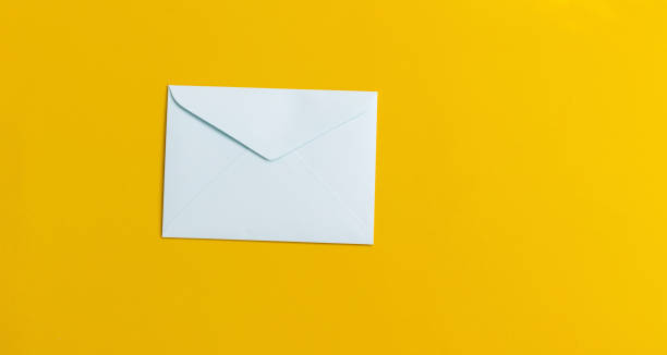 istock Envelopes ready to be delivered on a yellow background, communication concept. 1233420132