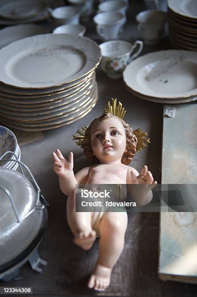 Baby Jesus Statuette Relegated To An Antiques Store Stock Photo - Download Image Now