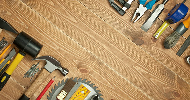 Different tools on a wooden background. stock photo