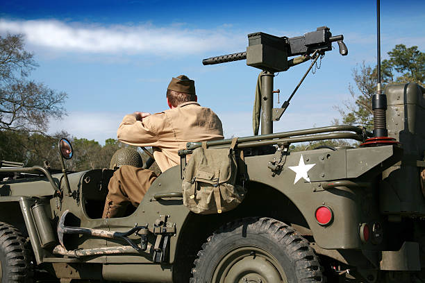 istock GI in WWII jeep with machine gun 123347182