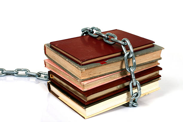 istock Chained to the books 123347185