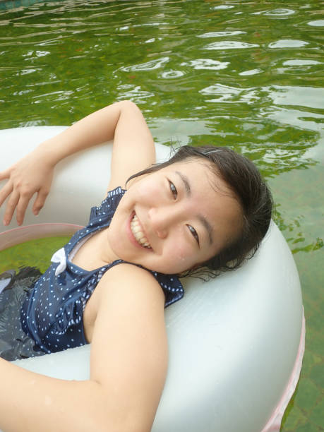 istock Japanese girl enjoys having hot spring 1233477643