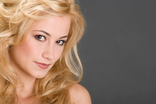 Portrait of a beautiful young woman with blond hair