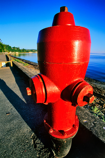Red fire hydrant in the small town of Parksville on Vancouver Island, British Columbia