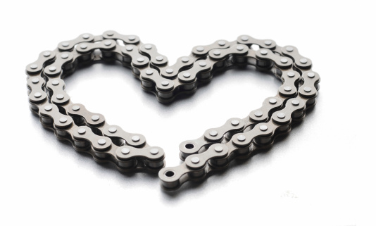 a bicycle chain forming a heart shape. 