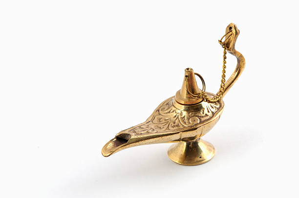 golden aladdin lamp golden aladdin lamp on white magic lamp photos stock pictures, royalty-free photos & images