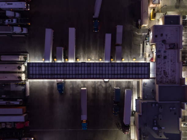 istock Top Down Aerial View of Trucks Refueling at Rest Stop at Night 1233539678
