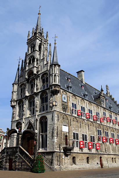 Gouda's old town hall (architect: Jan Kledermans; built: 1448-1450) is one of the oldest gothic town halls in the Netherlands. The external staircase in renaissance style was added in 1603. After undergoing a series of alterations it was returned to its original aspect during restoration work carried out between 1947 and 1952. On the east wall is a carillon which rings every half hour, with moving figures representing the granting of the town's charter by Count Floris V in 1272; Gouda, Netherlands