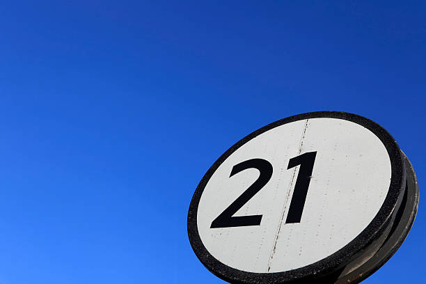 istock twenty one sign against a clear blue sky 123356363