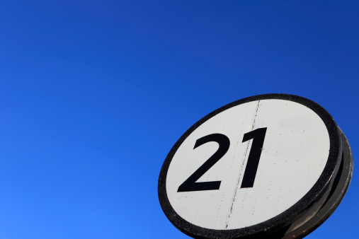 twenty one sign against a clear blue sky