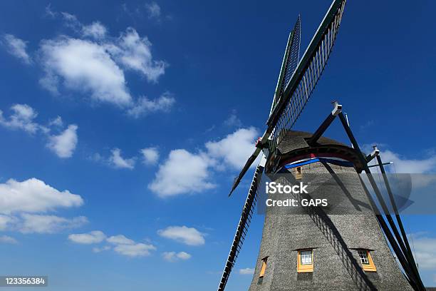 Dutch Windmill Against A Partly Clouded Sky Stock Photo - Download Image Now - Agricultural Equipment, Agriculture, Color Image