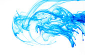 Colorful blue ink swirls on a white background