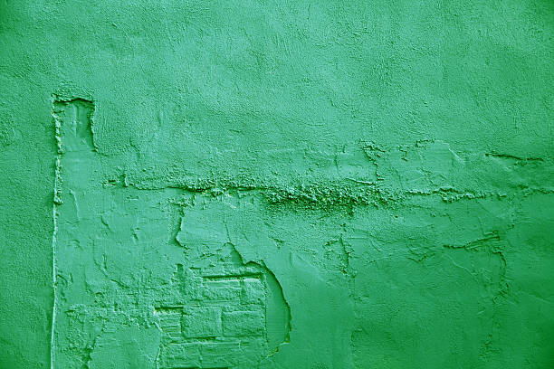 green wall close up shot of green painted wall. construction material torn run down concrete stock pictures, royalty-free photos & images