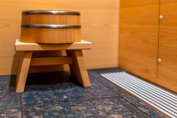 Cypress sauna bathtub wooden traditional Japanese room with water stool in home house or onsen hotel bathroom interior with nobody in Japan Cypress sauna bathtub wooden traditional Japanese room with water stool in home house or onsen hotel bathroom interior with nobody in Japan chamaecyparis stock pictures, royalty-free photos & images