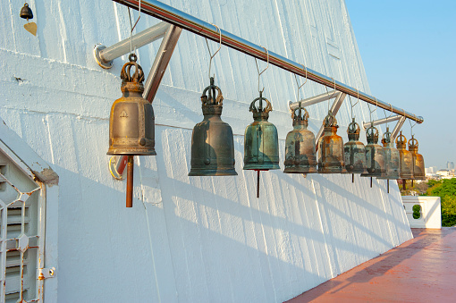 Temple Bells in Wat Saket (Golden Mount), Bangkok, Thailand\nBell Sound is auspicious which welcome divinity and dispels evil. Bells symbolize wisdom and compassion, which Buddhist practitioners recognize as being the path to Enlightenment