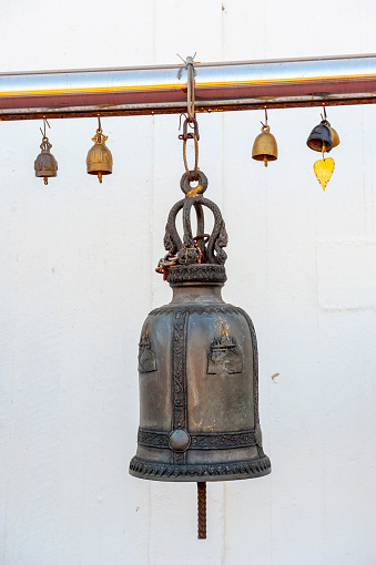 Temple Bells in Wat Saket (Golden Mount), Bangkok, Thailand\nBell Sound is auspicious which welcome divinity and dispels evil. Bells symbolize wisdom and compassion, which Buddhist practitioners recognize as being the path to Enlightenment