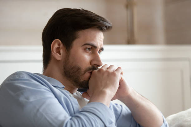 istock Close up head shot young thoughtful man looking away. 1233751509