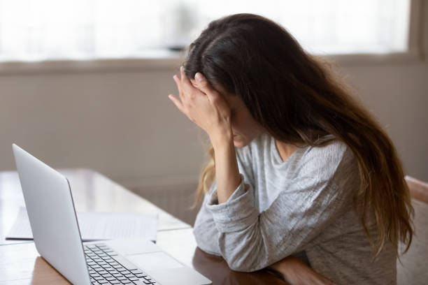 istock Tired girl having painful feelings due to computer overuse. 1233751646