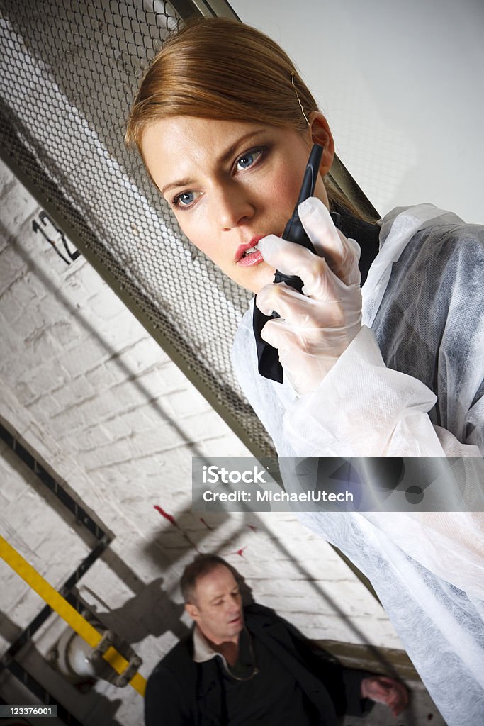 Calling For Backup A female police officer found a dead guy and calls for backup. CB Radio Stock Photo