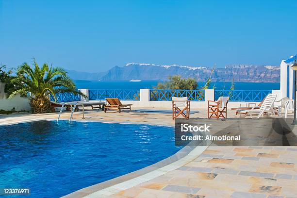 Blue Swimming Pool In Fira On Island Of Santorini Greece Stock Photo - Download Image Now