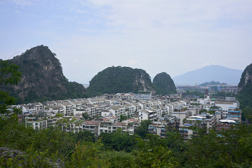 Guilin city view in the sunny day from the high mountain with river and green