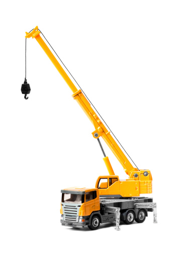 yellow toy truck crane isolated over white backgroung