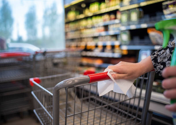 istock cleaning a grocery cart handle 1233895201