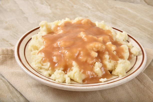 istock Bowl of mashed potatoes and turkey gravy 1233898761