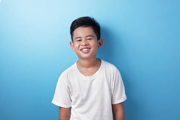 istock Cute Asian Boy Looking at Camera and Smiling Happily 1234009542