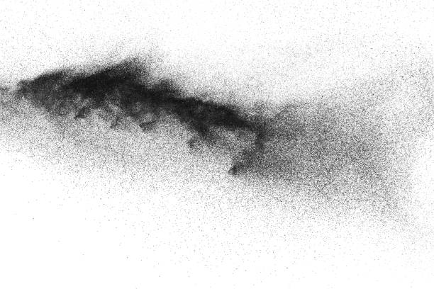 explosión de polvo negro contra fondo blanco. partículas de polvo negras salpicando. - blue flame natural gas fireplace fotografías e imágenes de stock