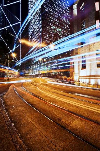 istock abstract lighting tail in night cityscape  with road and building background 1234192845