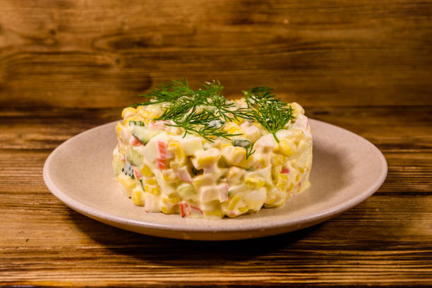 istock Salad with crab sticks, boiled eggs and cucumbers on a ceramic plate 1234196308