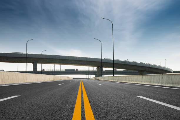 istock Clear blue sky and white clouds in the background, highway overpass curved approach bridge 1234409232