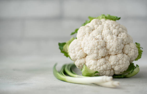 istock head of fresh cauliflower with green onions 1234419103
