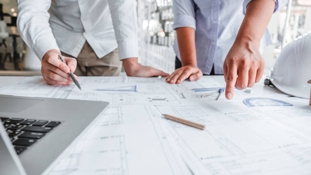istock Team Engineer drawing graphic planning and meeting for architectural project on workplace 1234434590