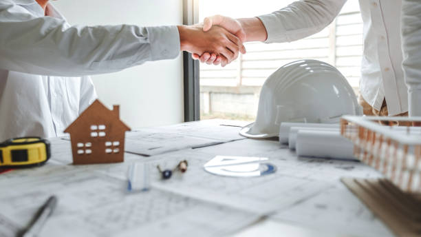 istock Team Engineer colleagues shaking hands and meeting for architectural project on workplace 1234439194