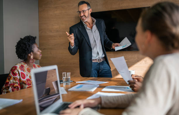 istock Manager talking with his diverse staff during a boardroom meeting 1234454207