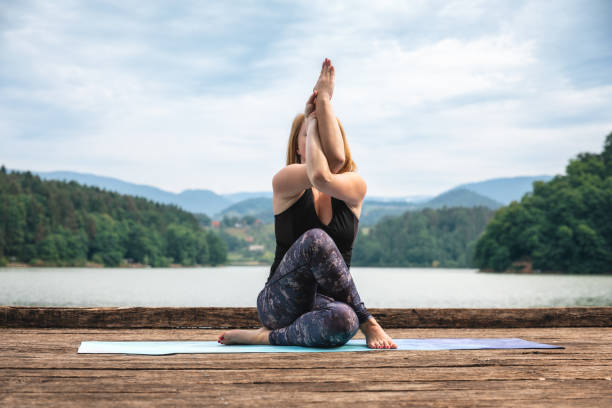 istock Woman Doing Yoga In Nature 1234498593