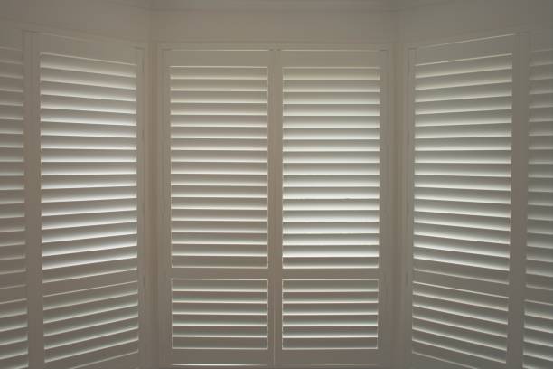 Plantation Shutters Luxury white indoor plantation shutters shutter stock pictures, royalty-free photos & images